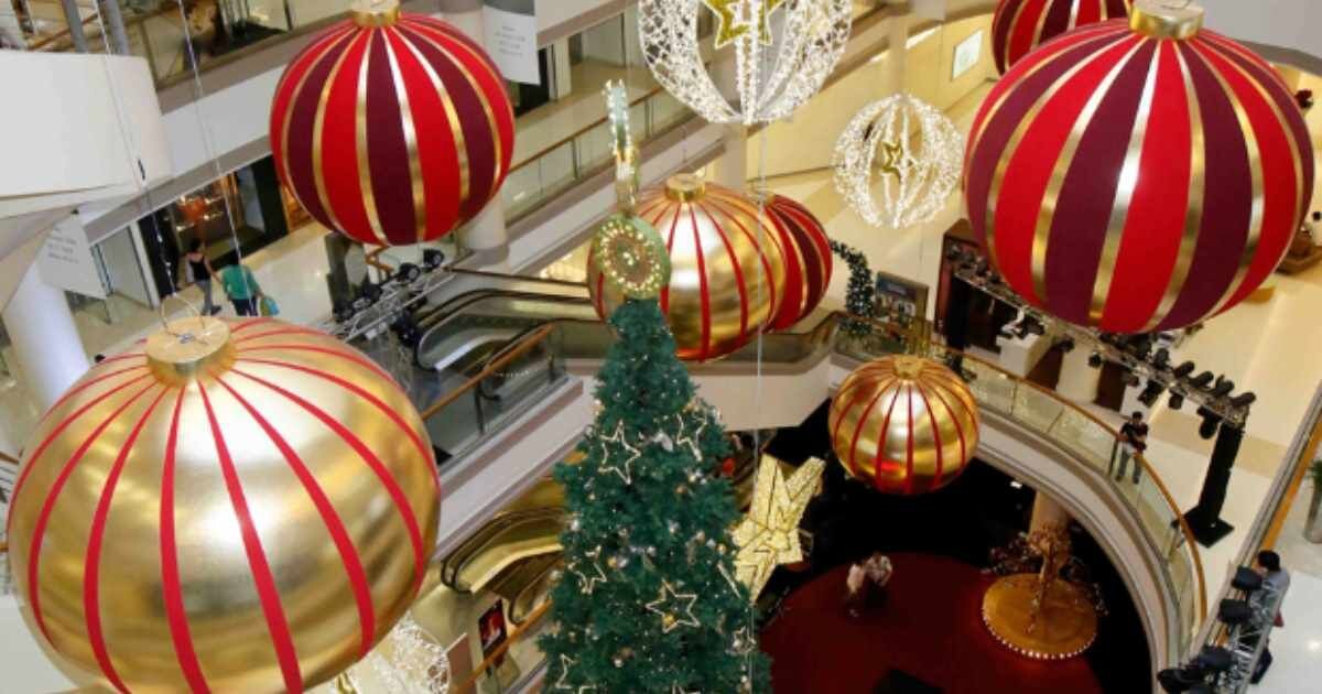Mall ornaments: Giant Christmas ornaments hanging in a mall atrium.